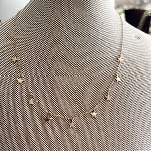 NWT genuine 14K yellow gold star necklace.